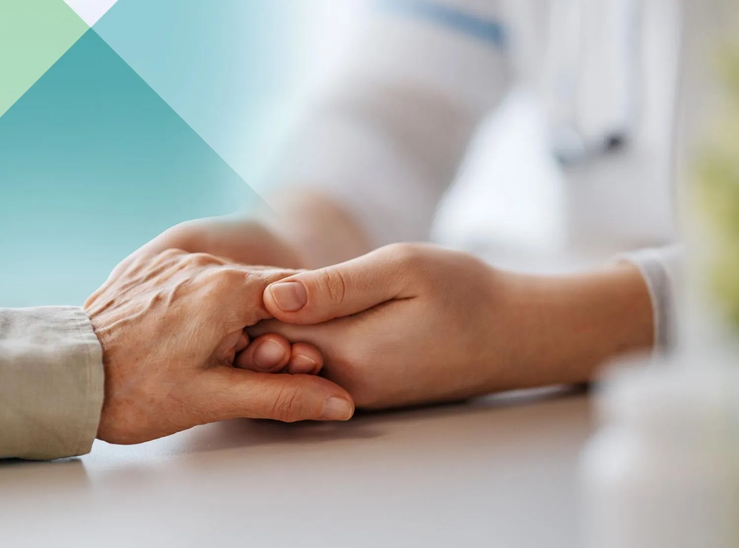 A caregiver holding a resident's hand